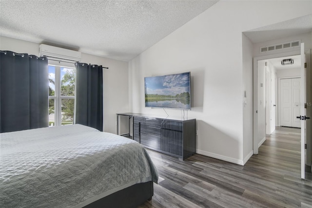 102 Royalty Cir, Sanford, FL 32771 - bedroom with a wall mounted AC, wood finished floors, a textured ceiling, and baseboards
