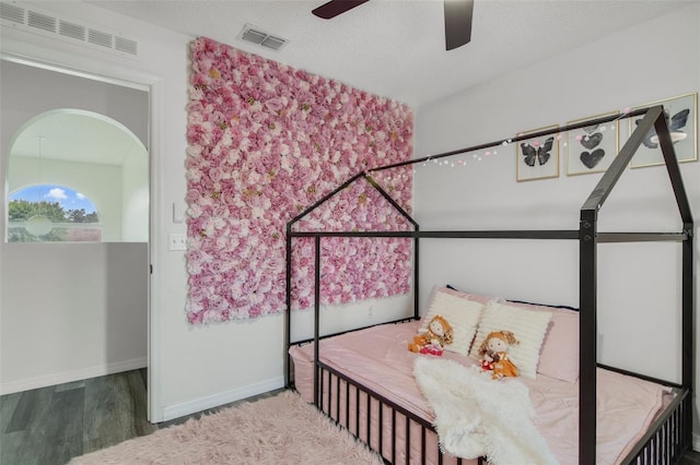102 Royalty Cir, Sanford, FL 32771 - bedroom with wood finished floors, baseboards, and a ceiling fan