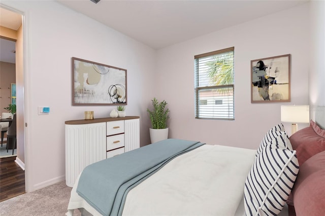carpeted bedroom with baseboards