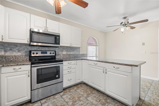 kitchen with appliances with stainless steel finishes, a ceiling fan, a peninsula, tasteful backsplash, and white cabinets