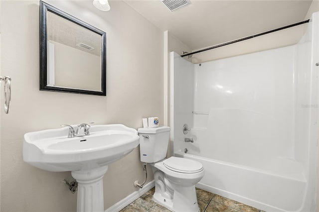 full bathroom featuring toilet, shower / tub combination, and baseboards