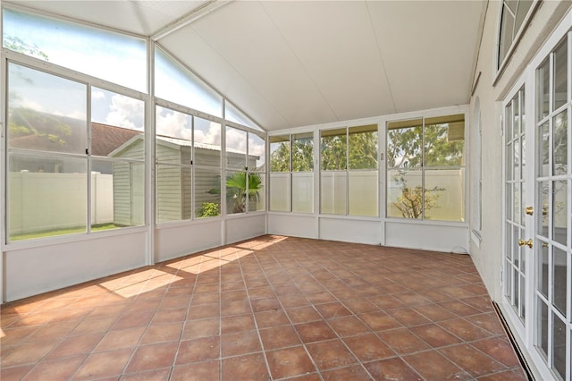 unfurnished sunroom featuring french doors and lofted ceiling