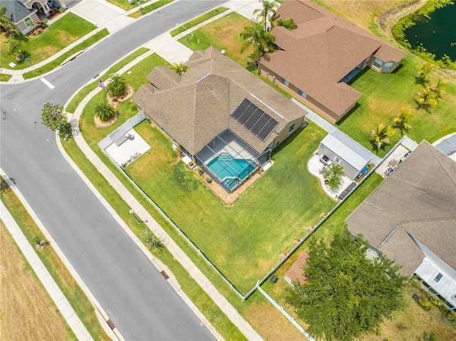 aerial view of property and surrounding area with a pool area