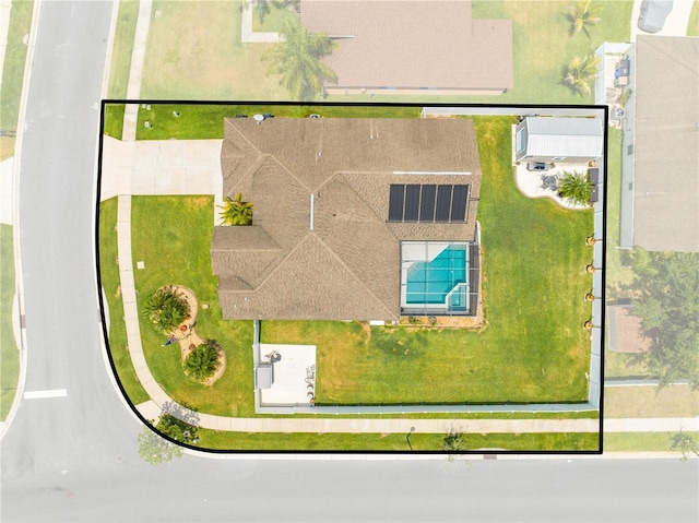 aerial view of property and surrounding area featuring a pool