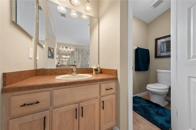 full bathroom featuring a shower stall, toilet, tile patterned floors, and vanity