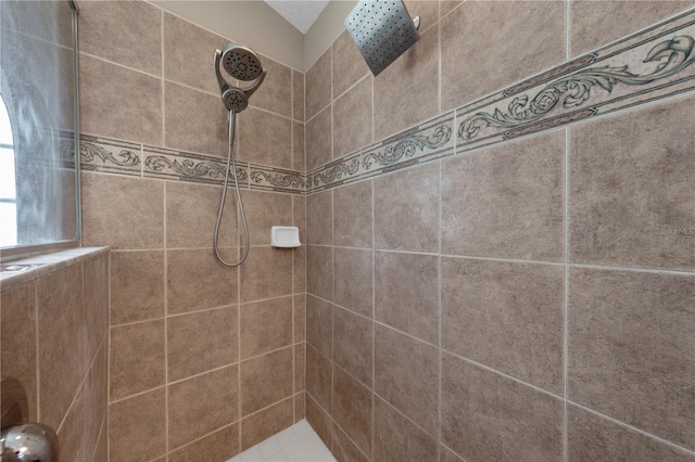 full bath with a tile shower