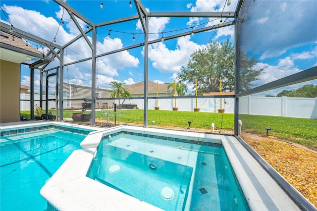 view of pool featuring a pool with connected hot tub and a lanai