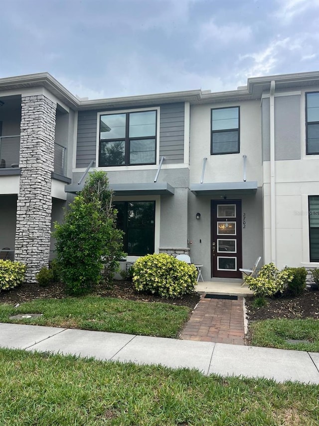 2702 Giardino Loop, Kissimmee, FL 34741 - townhome / multi-family property with stucco siding