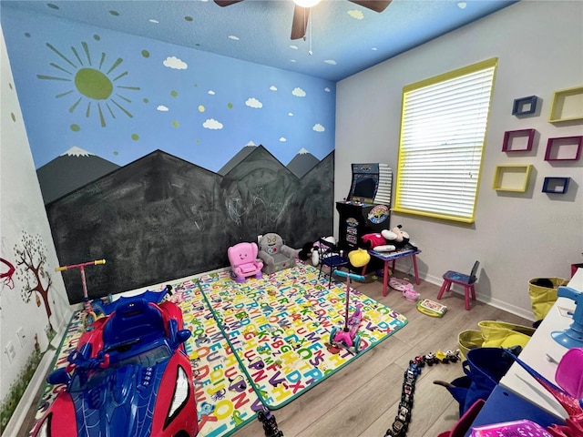 2691 Cypress Tree Trl, Saint Cloud, FL 34772 - playroom with wood finished floors, ceiling fan, and baseboards