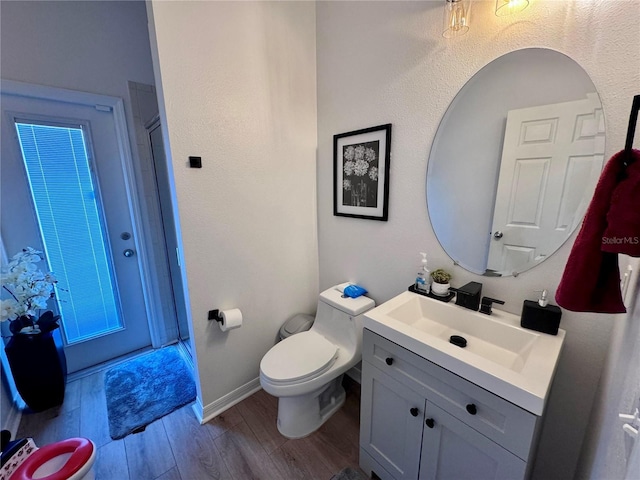 2691 Cypress Tree Trl, Saint Cloud, FL 34772 - full bath with wood finished floors, vanity, toilet, baseboards, and a shower