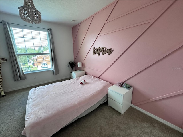 2691 Cypress Tree Trl, Saint Cloud, FL 34772 - bedroom with carpet floors, a chandelier, baseboards, and a textured ceiling