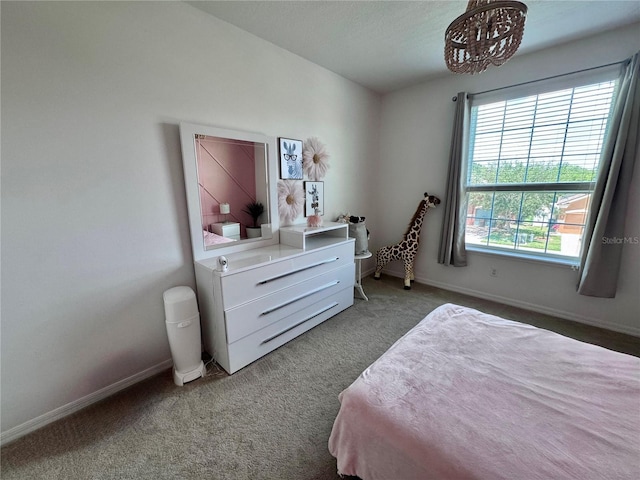 2691 Cypress Tree Trl, Saint Cloud, FL 34772 - bedroom featuring carpet floors, baseboards, and a chandelier