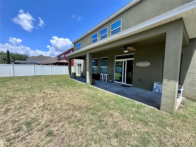 2691 Cypress Tree Trl, Saint Cloud, FL 34772 - rear view of property with a ceiling fan, stucco siding, and a patio area