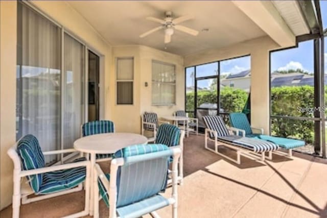 214 Tupelo Cir, Davenport, FL 33897 - sunroom featuring a ceiling fan and outdoor dining space