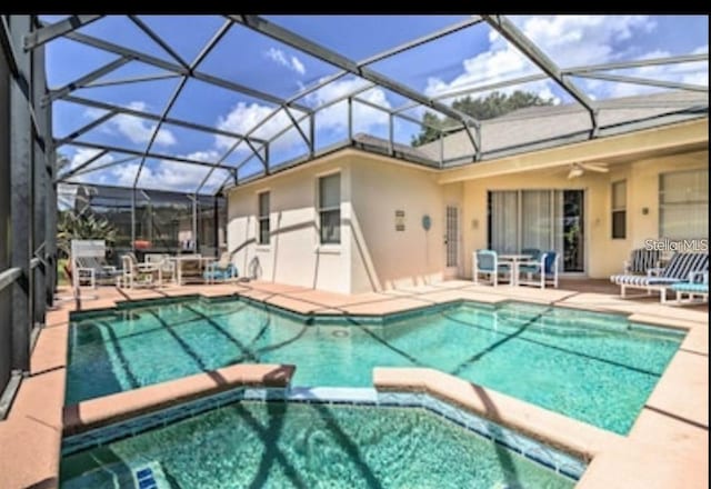 214 Tupelo Cir, Davenport, FL 33897 - view of pool with a patio, a pool with connected hot tub, ceiling fan, a lanai, and outdoor dining area