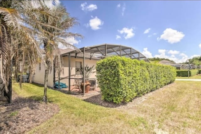 214 Tupelo Cir, Davenport, FL 33897 - view of green lawn featuring a lanai