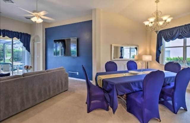 214 Tupelo Cir, Davenport, FL 33897 - dining space featuring a chandelier, carpet floors, and a ceiling fan