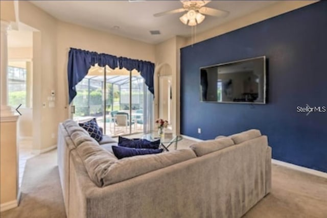 214 Tupelo Cir, Davenport, FL 33897 - living room featuring a ceiling fan, carpet floors, and baseboards