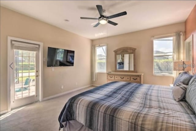 214 Tupelo Cir, Davenport, FL 33897 - bedroom with access to outside, carpet, baseboards, and ceiling fan