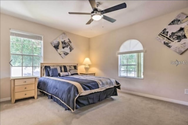 214 Tupelo Cir, Davenport, FL 33897 - bedroom featuring carpet floors, baseboards, and a ceiling fan