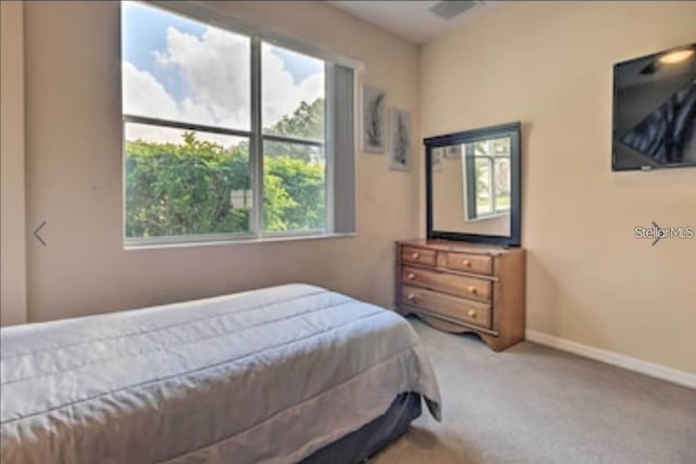 214 Tupelo Cir, Davenport, FL 33897 - carpeted bedroom featuring baseboards