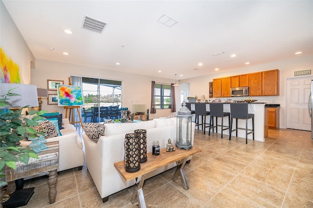 389 Yellow Snapdragon Dr, Davenport, FL 33837 - living room featuring recessed lighting