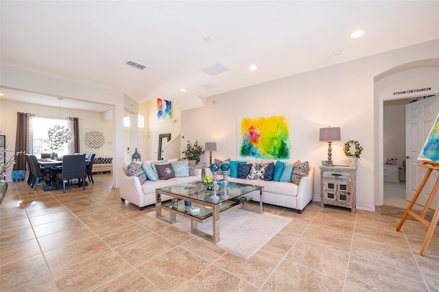 389 Yellow Snapdragon Dr, Davenport, FL 33837 - living room with recessed lighting, light tile patterned flooring, and arched walkways