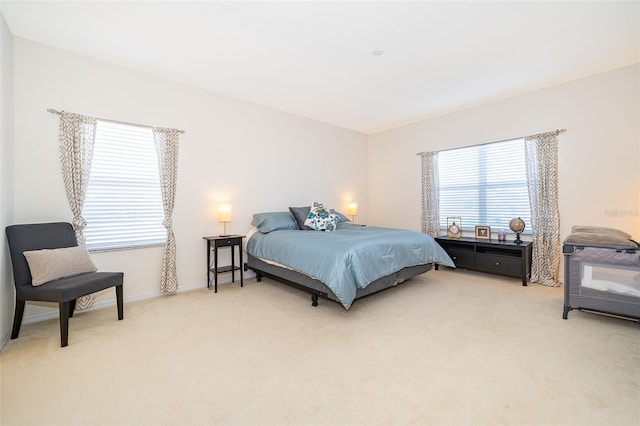 389 Yellow Snapdragon Dr, Davenport, FL 33837 - bedroom featuring light colored carpet and baseboards