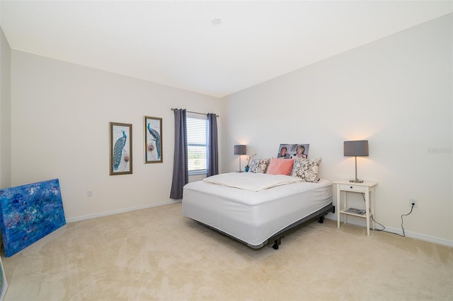 389 Yellow Snapdragon Dr, Davenport, FL 33837 - bedroom featuring light carpet and baseboards
