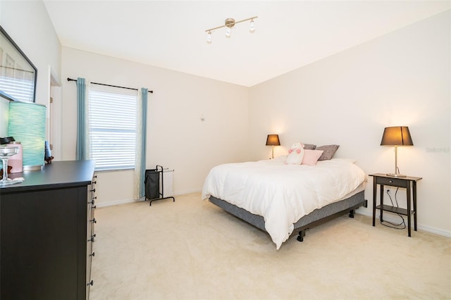 389 Yellow Snapdragon Dr, Davenport, FL 33837 - bedroom featuring light carpet and baseboards