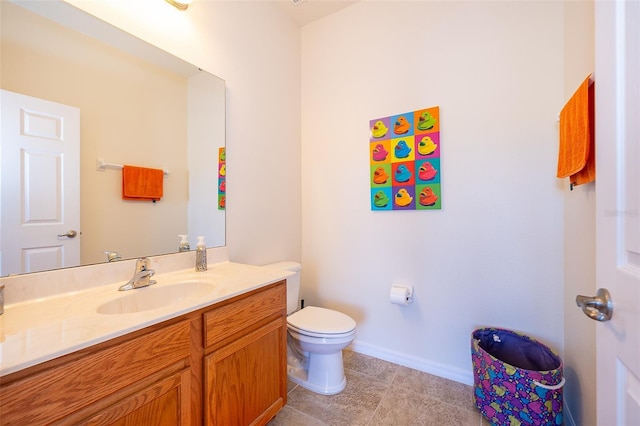 389 Yellow Snapdragon Dr, Davenport, FL 33837 - bathroom featuring baseboards, vanity, toilet, and tile patterned flooring