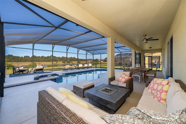 389 Yellow Snapdragon Dr, Davenport, FL 33837 - view of patio featuring an outdoor living space with a fire pit, a pool with connected hot tub, ceiling fan, outdoor dining area, and glass enclosure