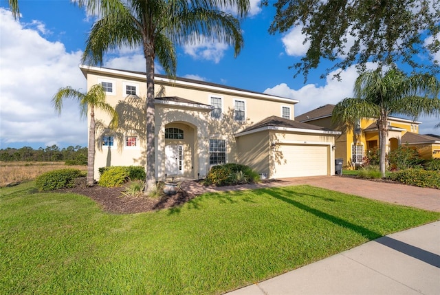 389 Yellow Snapdragon Dr, Davenport, FL 33837 - view of front of property featuring stucco siding, driveway, a front yard, and a garage