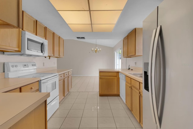 572 Floral Dr, Kissimmee, FL 34743 - kitchen with white appliances, a peninsula, a chandelier, light tile patterned flooring, and light countertops