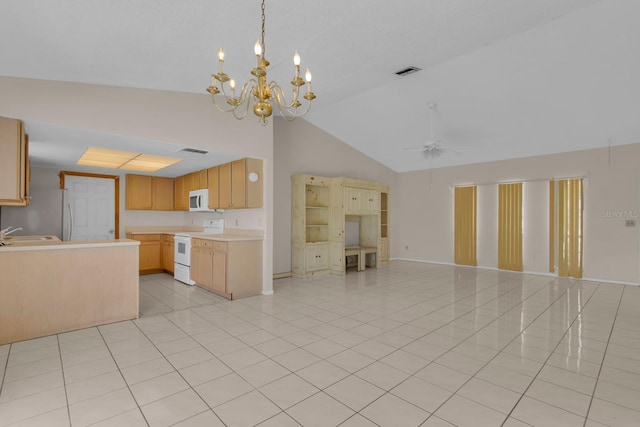 572 Floral Dr, Kissimmee, FL 34743 - kitchen with white appliances, open floor plan, high vaulted ceiling, light countertops, and a sink
