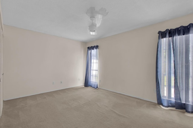 572 Floral Dr, Kissimmee, FL 34743 - spare room featuring carpet floors