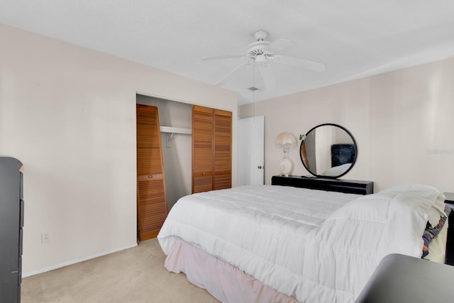 572 Floral Dr, Kissimmee, FL 34743 - bedroom featuring light carpet, a closet, ceiling fan, and baseboards