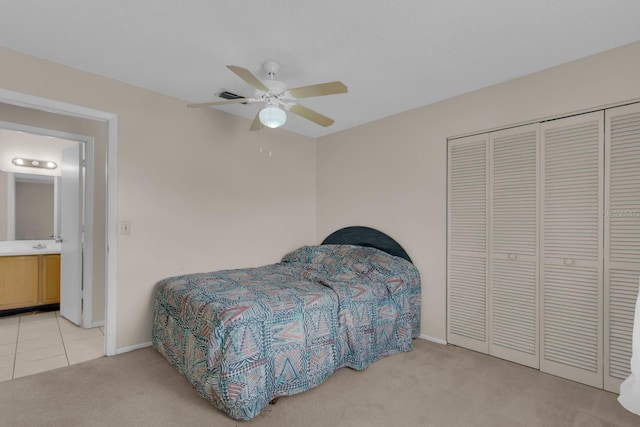 572 Floral Dr, Kissimmee, FL 34743 - bedroom featuring light carpet, baseboards, a closet, and ceiling fan