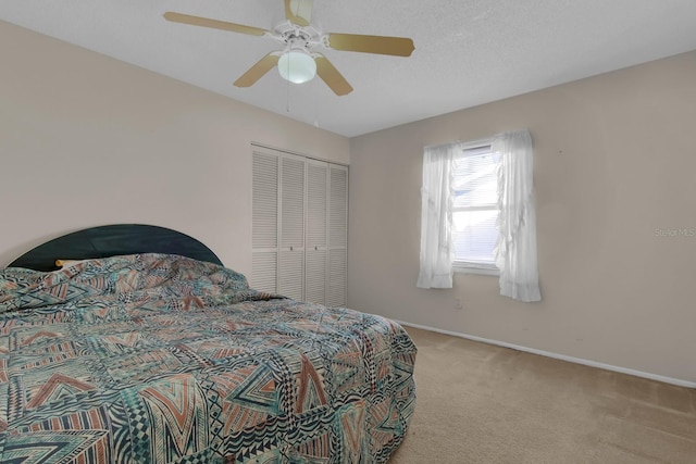 572 Floral Dr, Kissimmee, FL 34743 - bedroom with carpet floors, baseboards, ceiling fan, and a closet