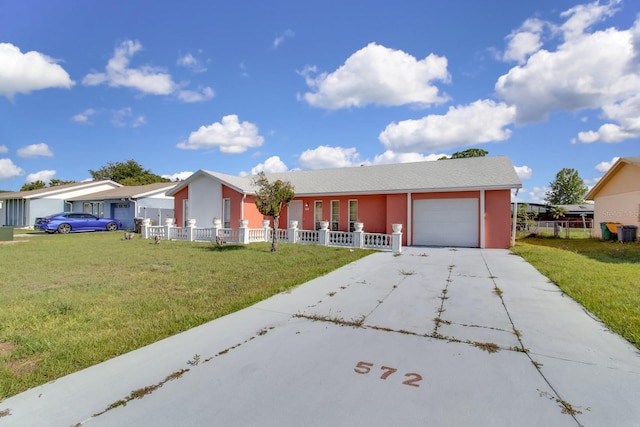 572 Floral Dr, Kissimmee, FL 34743 - ranch-style home featuring an attached garage, concrete driveway, and stucco siding