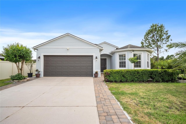 1688 Tamarind Rd, Davenport, FL 33896 - ranch-style house featuring an attached garage, concrete driveway, and stucco siding