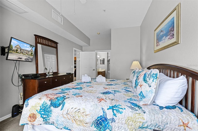 4551 Jonafree Ln Unit 103, Kissimmee, FL 34746 - carpeted bedroom with baseboards, connected bathroom, and a ceiling fan