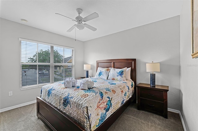 4551 Jonafree Ln Unit 103, Kissimmee, FL 34746 - carpeted bedroom featuring baseboards and a ceiling fan