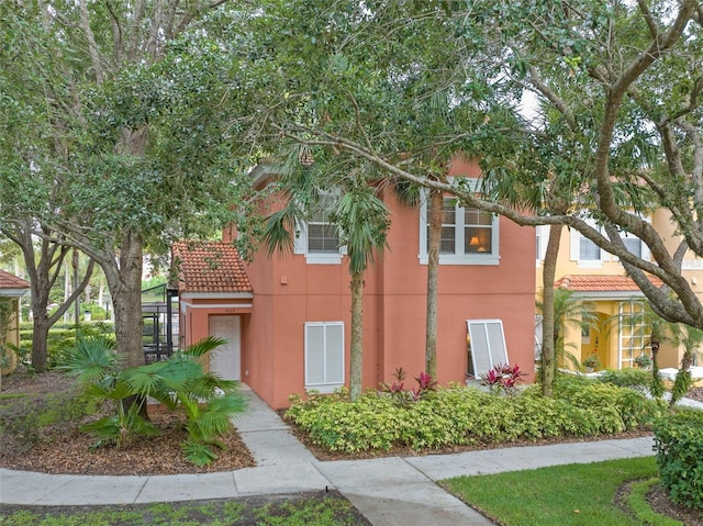 3015 Yellow Lantana Ln, Kissimmee, FL 34747 - view of property exterior with a tiled roof and stucco siding