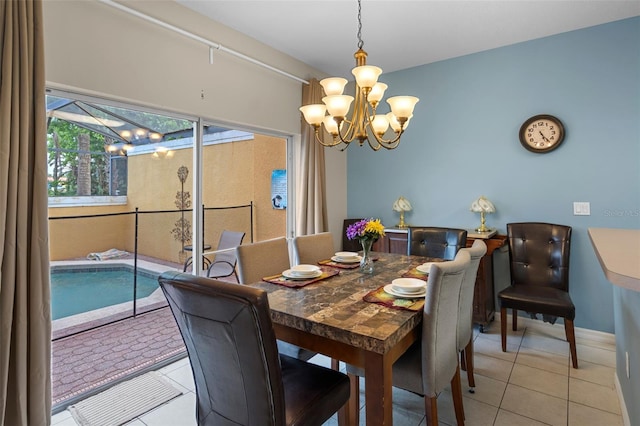 3015 Yellow Lantana Ln, Kissimmee, FL 34747 - dining space with light tile patterned floors, a chandelier, and baseboards