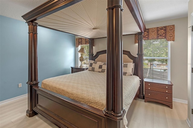 3015 Yellow Lantana Ln, Kissimmee, FL 34747 - bedroom with light wood-style flooring and baseboards