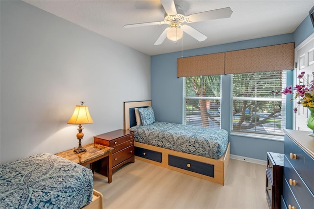 3015 Yellow Lantana Ln, Kissimmee, FL 34747 - bedroom featuring light wood finished floors, baseboards, and a ceiling fan