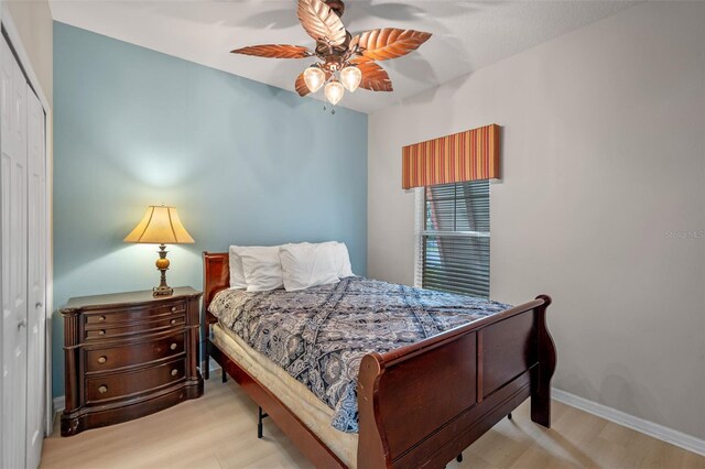 3015 Yellow Lantana Ln, Kissimmee, FL 34747 - bedroom with a closet, wood finished floors, ceiling fan, and baseboards