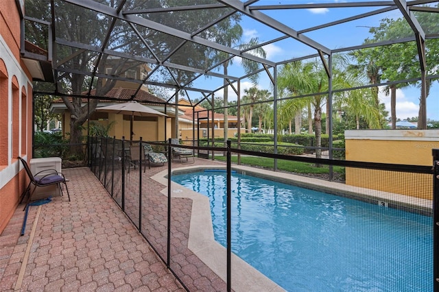 3015 Yellow Lantana Ln, Kissimmee, FL 34747 - view of pool featuring a patio area and glass enclosure