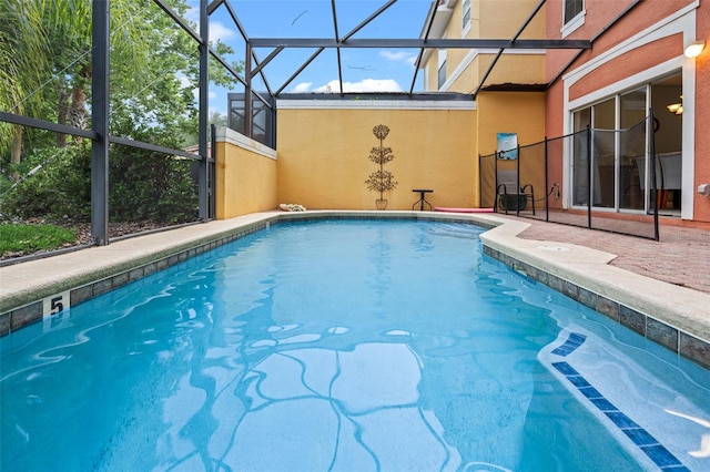 3015 Yellow Lantana Ln, Kissimmee, FL 34747 - outdoor pool featuring a lanai and a patio